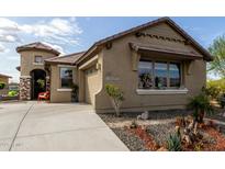Charming single-story home with well-manicured landscaping and a welcoming front entrance at 11571 E Chevelon Trl, Gold Canyon, AZ 85118