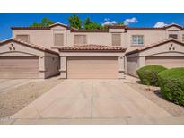 Inviting townhome featuring a private garage, neutral stucco, and a tile roof creating great curb appeal at 125 S 56Th St # 100, Mesa, AZ 85206
