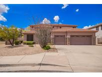 Charming two-story home features a spacious three-car garage and desert landscaping at 2146 S Drexel --, Mesa, AZ 85209