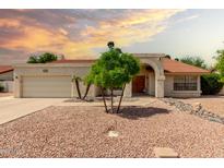 Charming single-story home with desert landscaping, a red tile roof, and a two-car garage at 3308 N Nebraska St, Chandler, AZ 85225