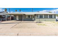 Charming single-story home with a well-maintained front yard and covered parking area at 3502 W Gardenia Ave, Phoenix, AZ 85051