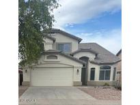 Charming two-story home featuring a two-car garage and well-maintained landscaping at 56 W Holstein Trl, San Tan Valley, AZ 85143
