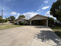Charming home with large driveway and covered carport, ideal for parking and outdoor gatherings at 601 W 15Th St, Tempe, AZ 85281