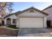Charming single-story home with a two-car garage and well-maintained front yard at 6331 W Winslow Ave, Phoenix, AZ 85043