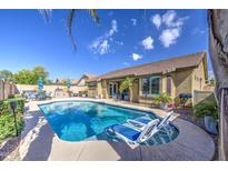 Sparkling pool with lounge chairs and outdoor dining area, perfect for relaxing and entertaining at 737 W Desert Valley Dr, San Tan Valley, AZ 85143