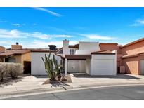 Inviting home featuring desert landscaping, a covered carport, and a single-car garage at 7826 N 21St Ln, Phoenix, AZ 85021