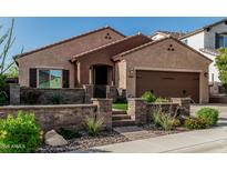 Charming single-story home featuring desert landscaping, a private courtyard, and an attached two-car garage at 1322 W Spur Dr, Phoenix, AZ 85085