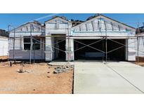 New construction home showcases scaffolding around the exterior, set to be completed soon at 5086 E Midnight Star Dr, San Tan Valley, AZ 85143