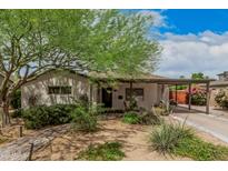 Attractive home with a covered carport, a brick walkway, and appealing landscaping at 6726 N 11Th St, Phoenix, AZ 85014