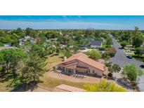 Expansive property showcasing a desert-landscaped yard and a charming single-story house with a terracotta roof at 1637 S Los Alamos Cir, Mesa, AZ 85204