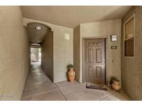 Neutral front door with unit number on the right, and welcome mat at 5303 N 7Th St # 118, Phoenix, AZ 85014