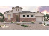 Charming single-story home featuring stone accents, a neutral color scheme, and desert landscaping at 6716 N 190Th Dr, Waddell, AZ 85355