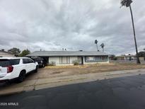 Quaint single-story home featuring classic architecture and a muted color palette at 14839 N 29Th Dr, Phoenix, AZ 85053