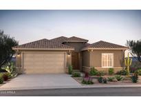 Charming single-story home showcasing desert landscaping and a neutral color palette, blending seamlessly with its surroundings at 17776 W Getty Dr, Goodyear, AZ 85338