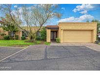 Charming home featuring mature landscaping, a private entrance and a spacious two-car garage at 2217 W Claremont St, Phoenix, AZ 85015