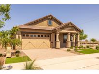 Charming single-story home featuring a two-car garage and well-manicured landscaping at 23162 E Canary Way, Queen Creek, AZ 85142