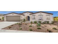 Charming single-story home featuring desert landscaping, a neutral color scheme, and a welcoming arched entryway at 2437 W Jessica Ln, Phoenix, AZ 85041