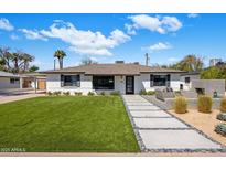 Charming single story home with meticulously landscaped front yard and walkway, perfect for a Gathering at 3630 N 39Th St, Phoenix, AZ 85018