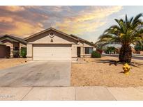 Charming single-story home featuring a low-maintenance desert landscape and a two-car garage at 8502 W Pierson St, Phoenix, AZ 85037
