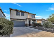 Charming two-story home features a well-manicured front yard with an attached two-car garage at 920 E Leslie E Ave, San Tan Valley, AZ 85140