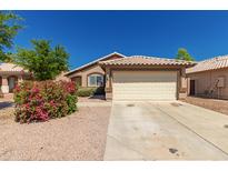 Attractive single-story home with a tile roof and a two-car garage at 16112 W Buchanan St, Goodyear, AZ 85338