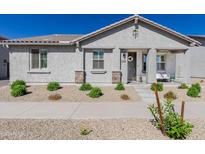 Charming single-story home with desert landscaping, covered porch, and neutral color palette at 25202 N 142Nd Dr, Surprise, AZ 85387