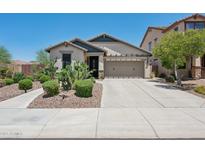 Inviting single-story home featuring a desert landscaped front yard and an attached two-car garage at 12062 W Duane Ln, Peoria, AZ 85383