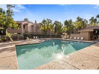 Enjoy this beautiful pool with lounge seating and desert landscaping in this well-maintained community at 15252 N 100Th St # 1154, Scottsdale, AZ 85260