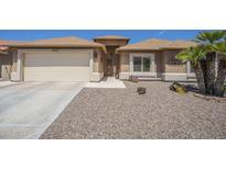 Charming single-story home featuring a low-maintenance desert landscape, attached garage, and inviting front entrance at 1562 E Gleneagle Dr, Chandler, AZ 85249