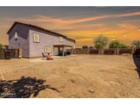 Spacious backyard featuring desert landscaping, an open patio, and string lights for outdoor entertaining at 1753 E Maddison Cir, San Tan Valley, AZ 85140