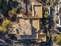 Expansive new home under construction boasts a spacious layout, and beautiful desert surroundings at 29121 N 105Th St, Scottsdale, AZ 85262