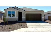 Charming single-story home features a 2-car garage, desert landscaping and neutral color palette at 35545 N Breezy Ln, San Tan Valley, AZ 85140