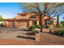 Charming two-story home featuring a three-car garage and mature desert landscaping at 4055 N Recker Rd # 71, Mesa, AZ 85215