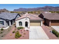 Charming single-story home featuring a desert landscaped yard and a two-car garage at 12538 E Pivot Peak --, Gold Canyon, AZ 85118