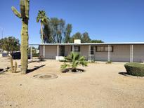 Charming single-story home with desert landscaping, including a mature saguaro cactus in the front yard at 649 S 87Th Way, Mesa, AZ 85208
