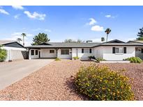 Charming single-story home with well-maintained landscaping and a spacious driveway at 2232 E Karen Dr, Phoenix, AZ 85022