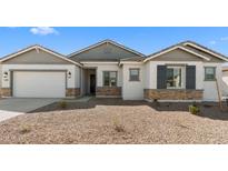 Charming single-story home with stone accents, neutral tones, and a well-maintained desert landscape at 37785 W Santa Maria St, Maricopa, AZ 85138