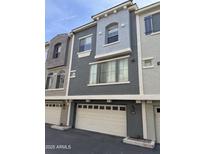Charming townhome exterior with a two-car garage and stucco finish at 2402 E 5Th St # 1428, Tempe, AZ 85288