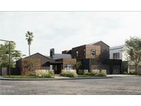 Contemporary home with wood and dark accents, showcasing modern design and landscaping at 4002 N 34Th St, Phoenix, AZ 85018