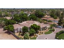 Expansive desert property featuring mature trees, private driveway and lush landscaping at 6243 E Camelback Rd, Scottsdale, AZ 85251