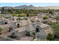 Stunning aerial view of the neighborhood showcasing tile roofs and desert landscaping with mountain backdrop at 7705 E Doubletree Ranch Rd # 51, Scottsdale, AZ 85258