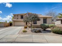 Beautiful two-story home with a tile roof, well-maintained landscaping, and a two car garage at 1517 E Elaine Dr, Casa Grande, AZ 85122