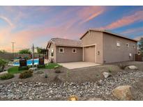 Charming single-Gathering home features a private pool, desert landscaping, and an attached garage at 24280 N 164Th Dr, Surprise, AZ 85387