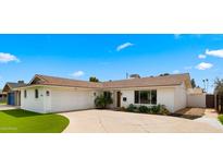 Charming single-level home with a well-maintained yard, attached garage and inviting curb appeal at 8631 E Jackrabbit Rd, Scottsdale, AZ 85250
