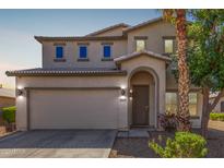 Charming two-story home with a two-car garage and beautifully landscaped front yard at 29051 N Shannon Dr, San Tan Valley, AZ 85143