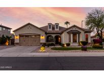 Charming single-story home with a well-manicured lawn and a spacious two-car garage at 3150 E Isaiah Ave, Gilbert, AZ 85298