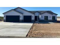 Beautiful single-story home featuring a two-car garage and desert landscaping, presenting a modern and inviting facade at 34889 N 3Rd St, Phoenix, AZ 85086