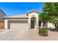 Charming single-story home featuring a neutral color palette, arched entry, and a well-manicured landscape at 3994 E Maplewood St, Gilbert, AZ 85297