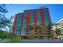 Modern high rise building with palm tree landscaping along the street at 4808 N 24Th St # 527, Phoenix, AZ 85016