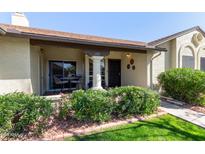 Inviting front porch featuring stylish seating and well-maintained landscaping at 8140 N 107Th Ave # 142, Peoria, AZ 85345